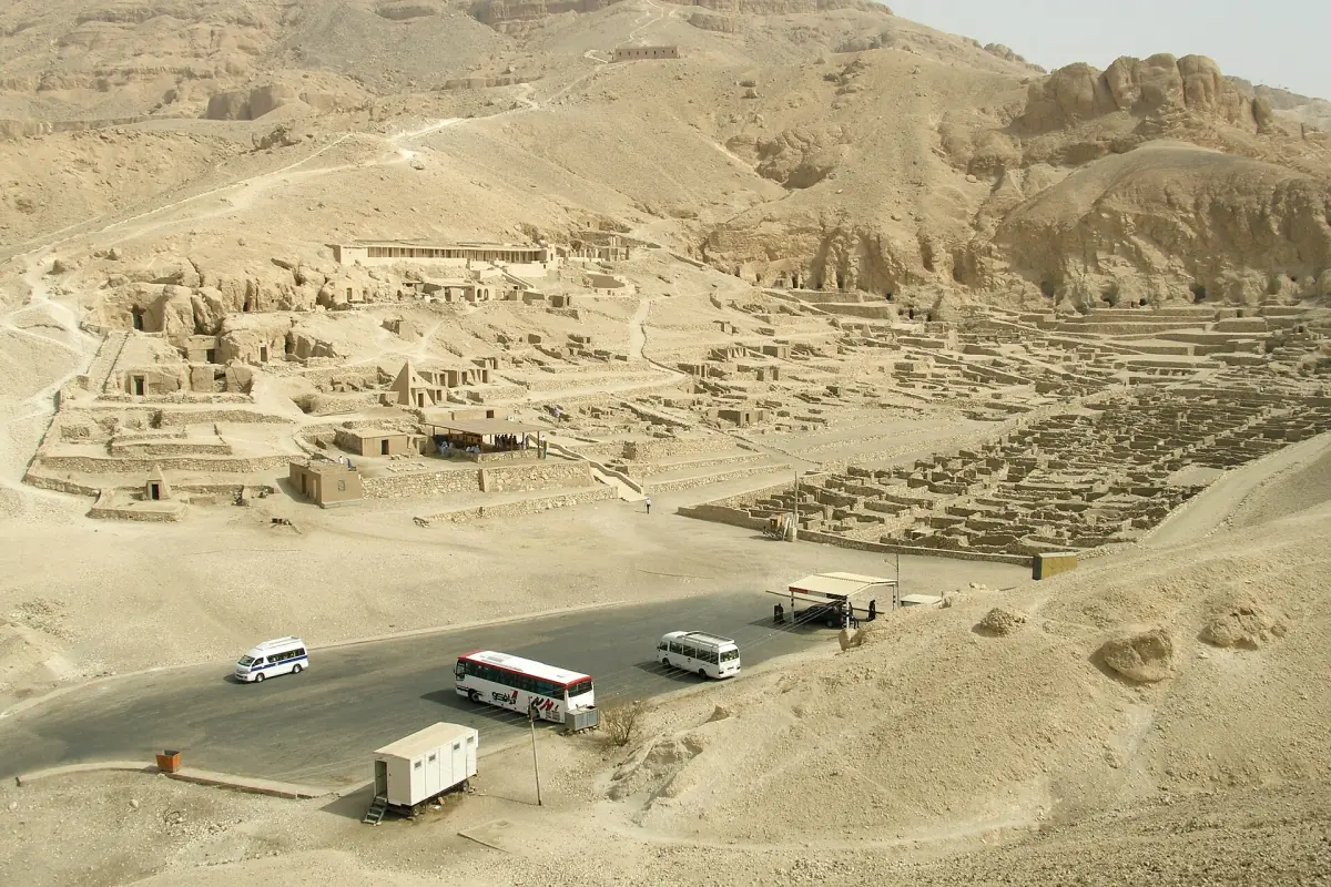 The Theban Necropolis with tour buses below the cliffs